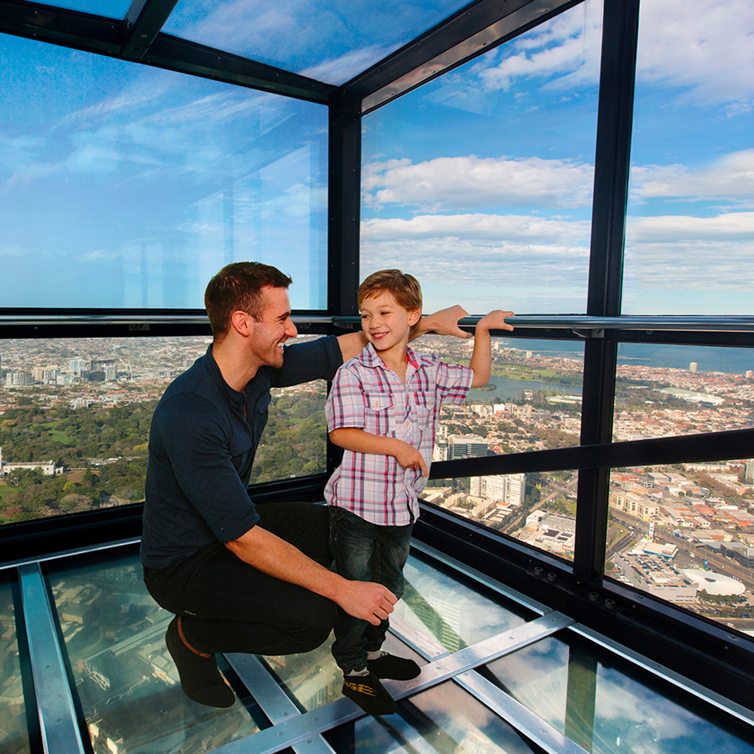 Father and son enjoying the view from Melbourne Skydeck at Eureka Tower.