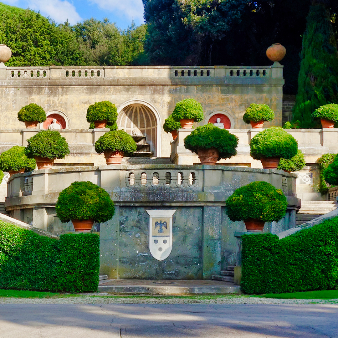 Apostolic Palace gardens with manicured hedges and stone architecture, Castel Gandolfo, Italy.