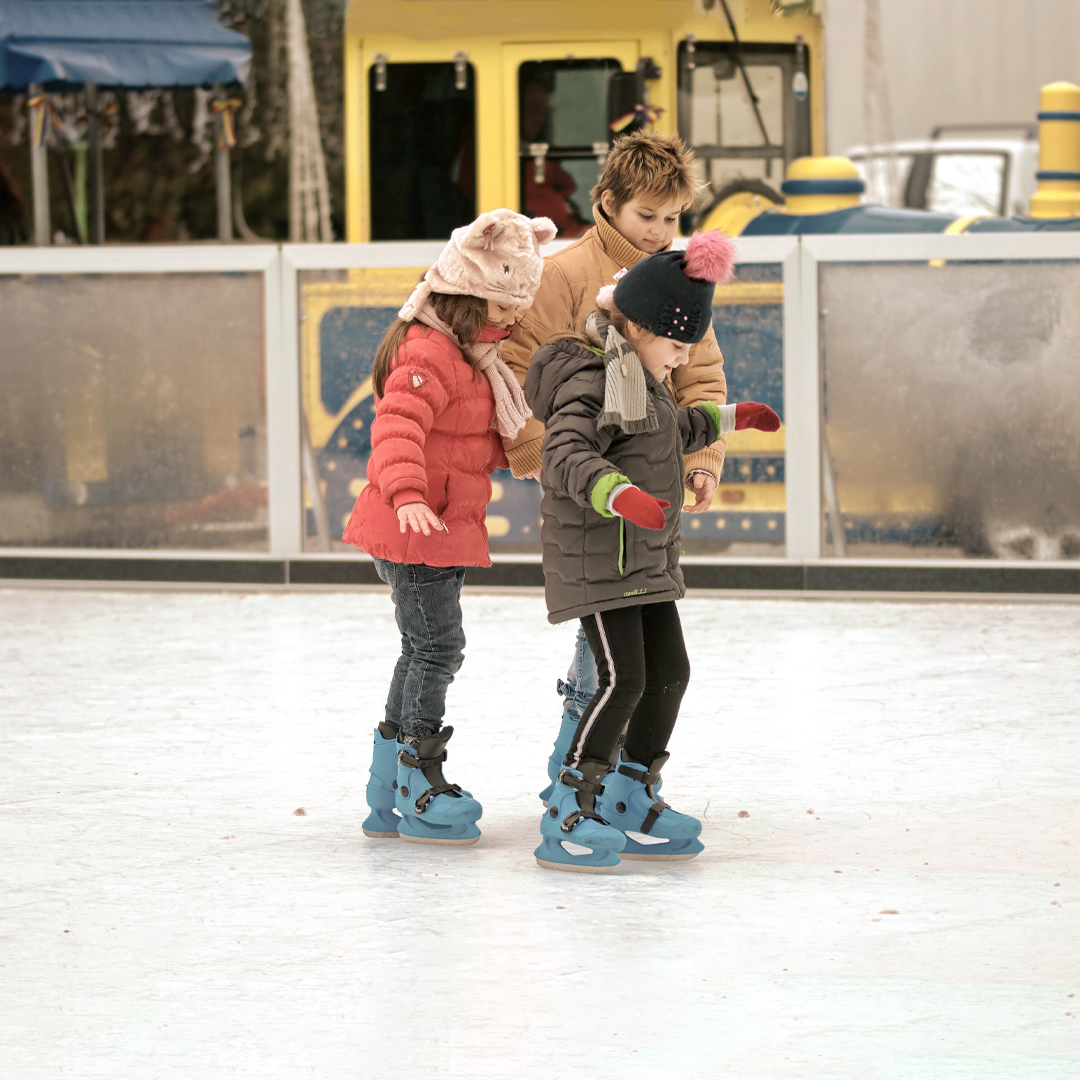 Children ice skating at Alexandra Palace Ice Rink in London.