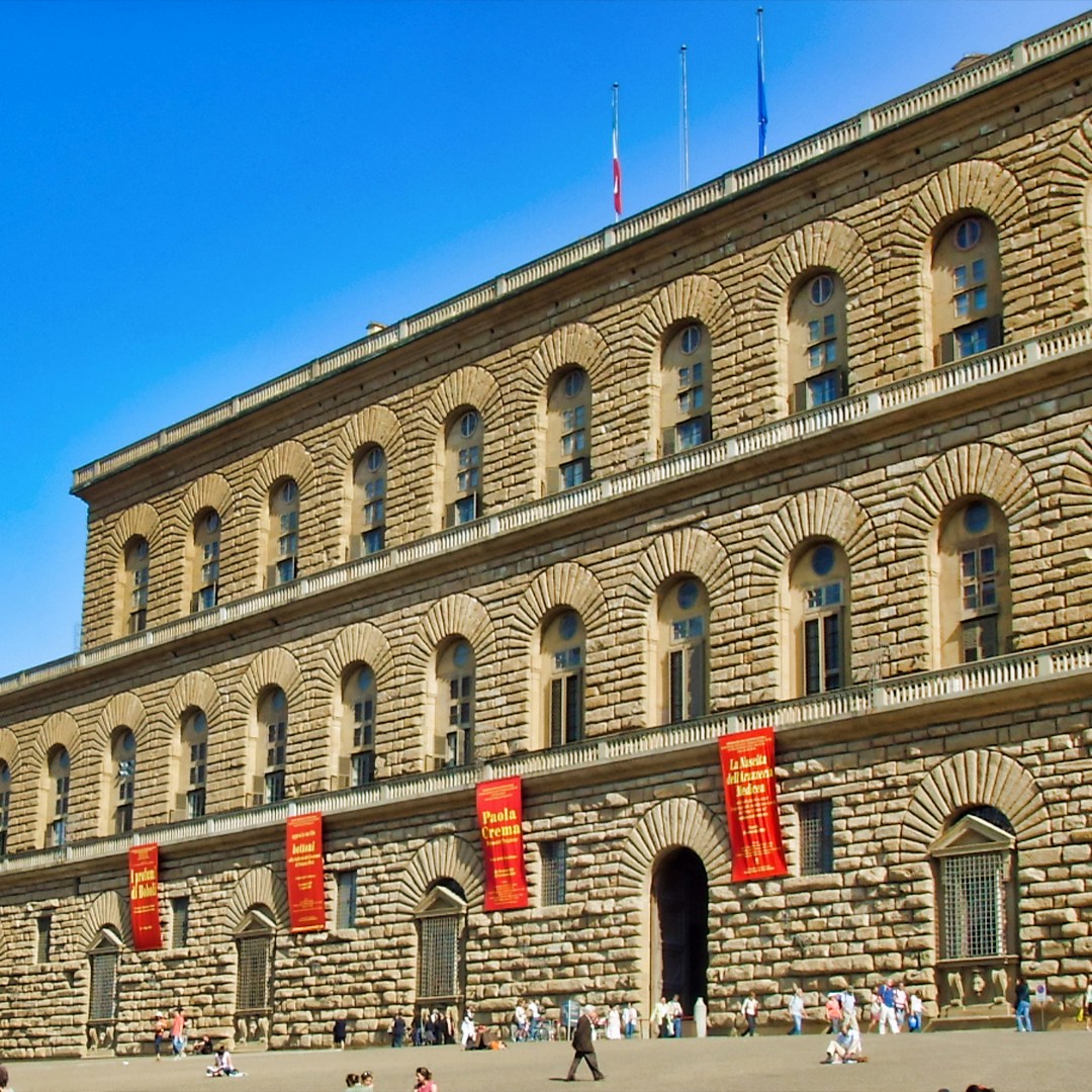 Pitti Palace facade with visitors, Florence, Italy.