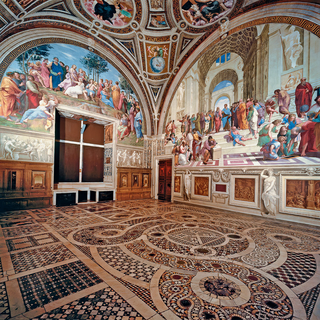 Vatican Museums frescoes in Rome, featuring intricate artwork and detailed floor patterns.