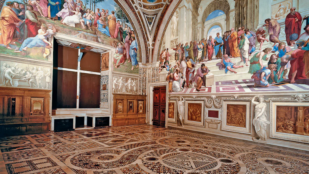 Vatican Museums frescoes in Rome, featuring intricate artwork and detailed floor patterns.