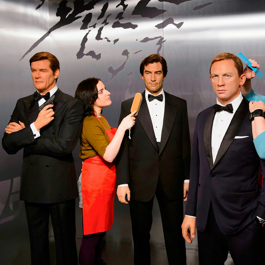 Wax figures of men in tuxedos at Madame Tussauds London.
