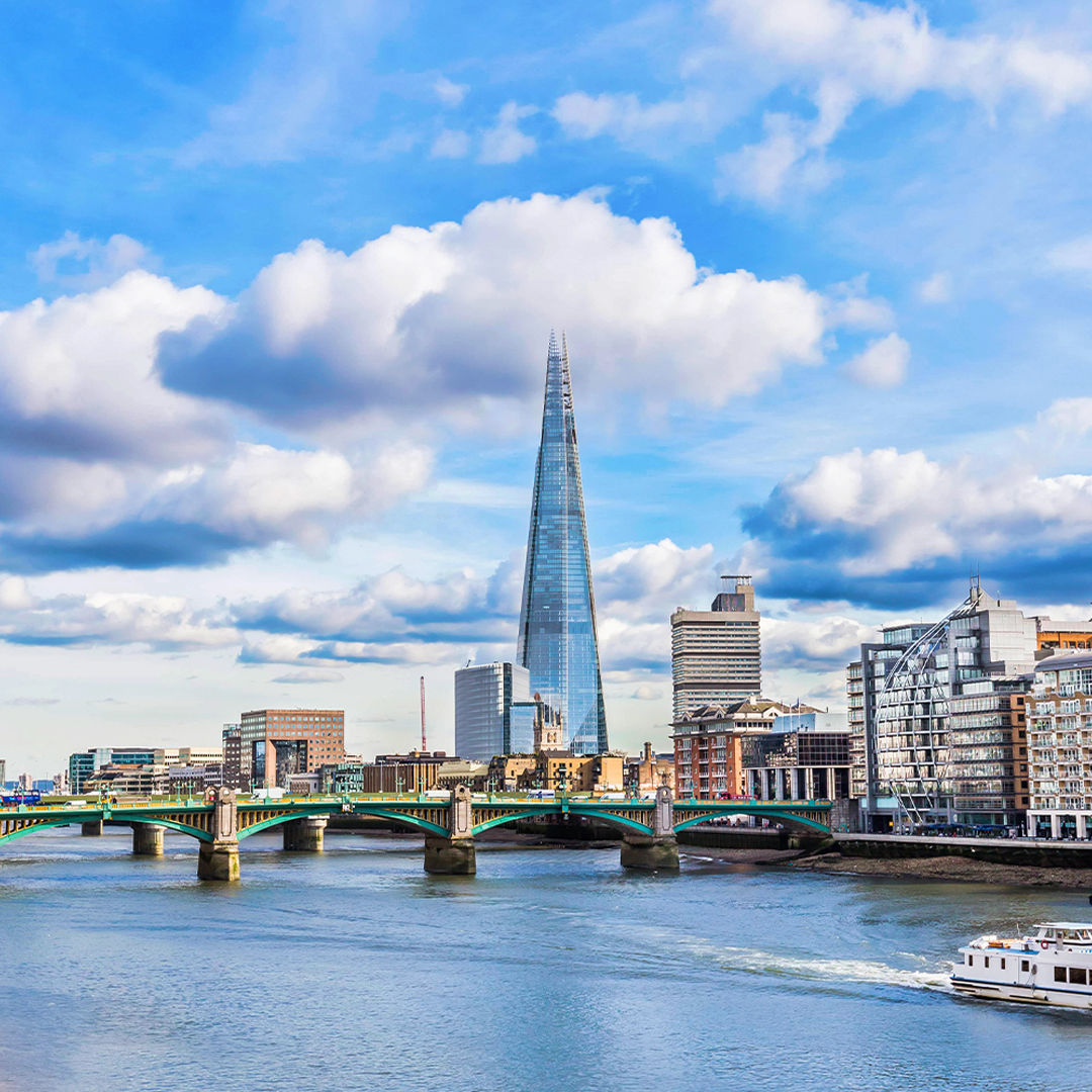 Thames River with view of the Shard and cityscape in London.
