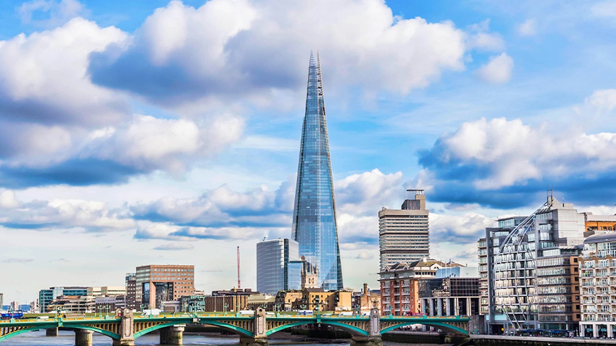 Thames River with view of the Shard and cityscape in London.