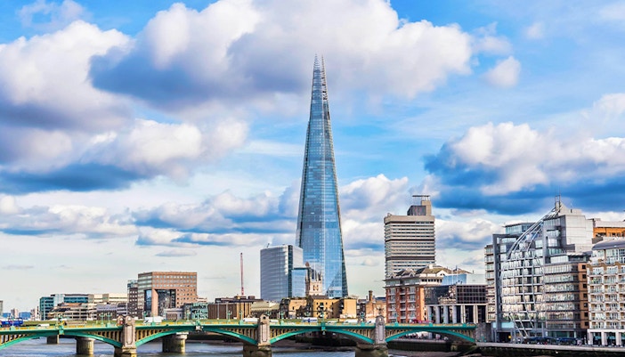 Thames River with view of the Shard and cityscape in London.
