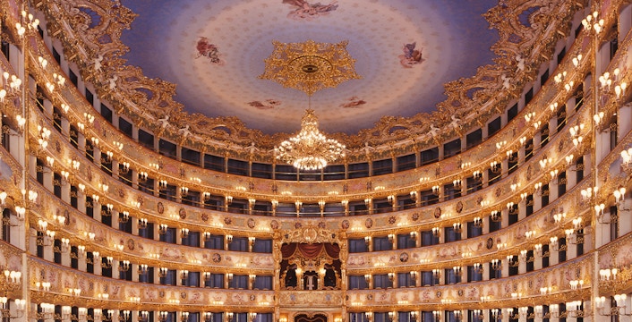 Teatro La Fenice interior with ornate ceiling and chandeliers, Venice.