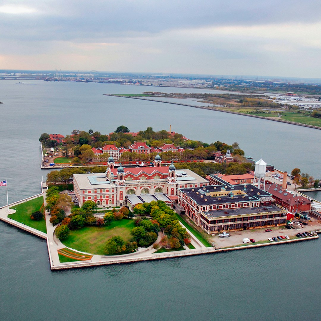 Ellis Island aerial view with historic buildings and surrounding water, New York City.