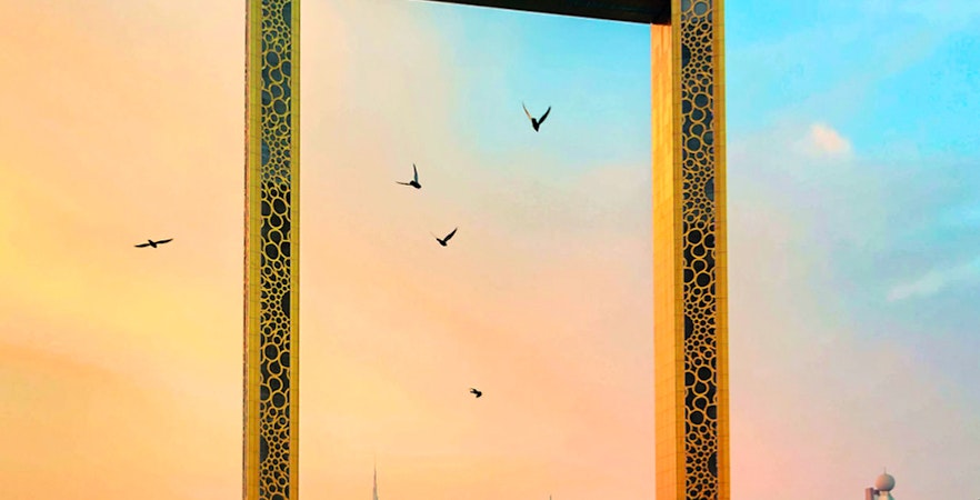 Dubai Frame with city skyline at sunset, part of Dubai City Tour.