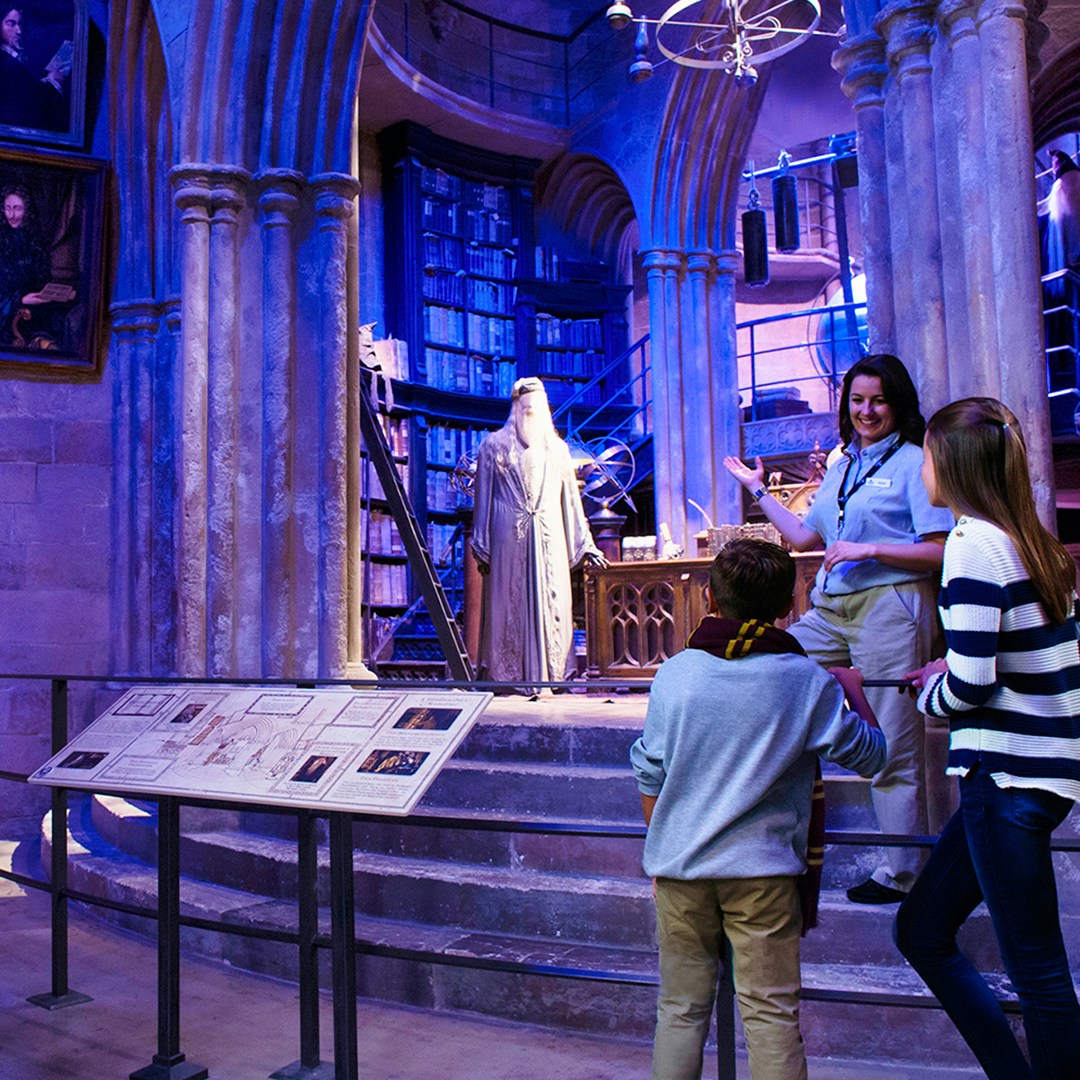 Warner Bros. Studio London tour showcasing Harry Potter's Great Hall set with guided group.