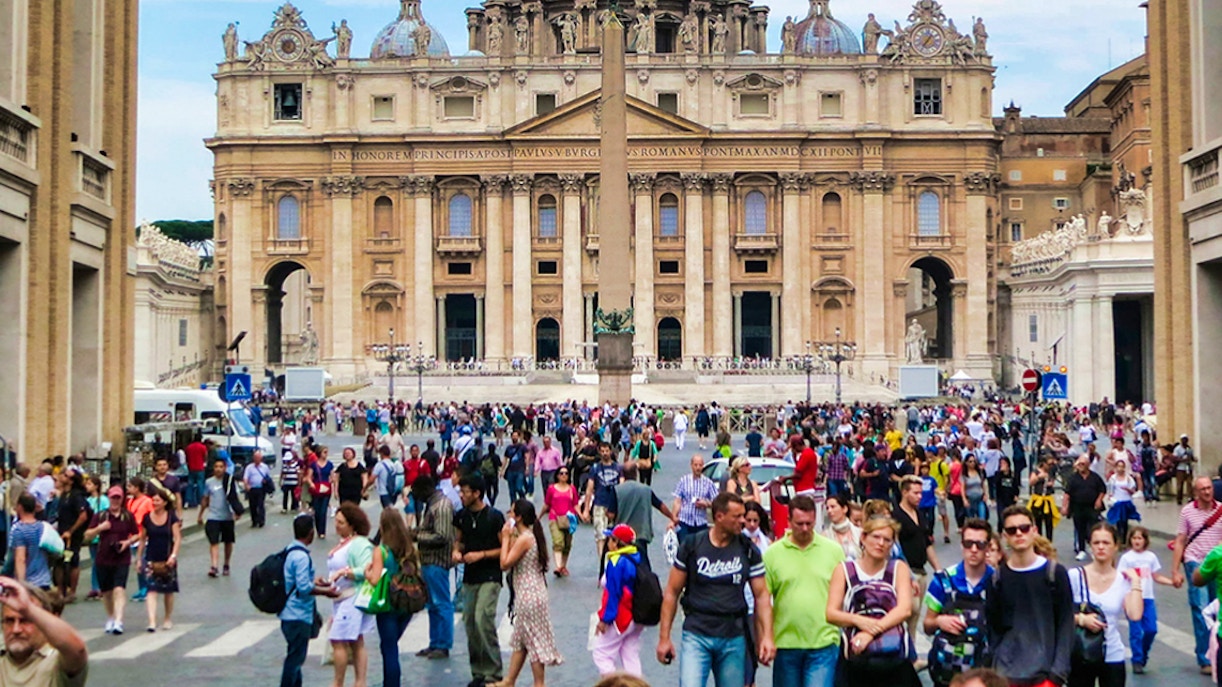 St. Peter’s Basilica interior with guided tour group exploring Vatican Necropolis.